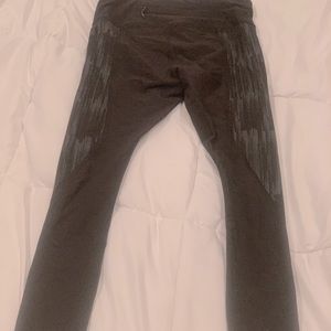 Black Lululemon compression running tights.